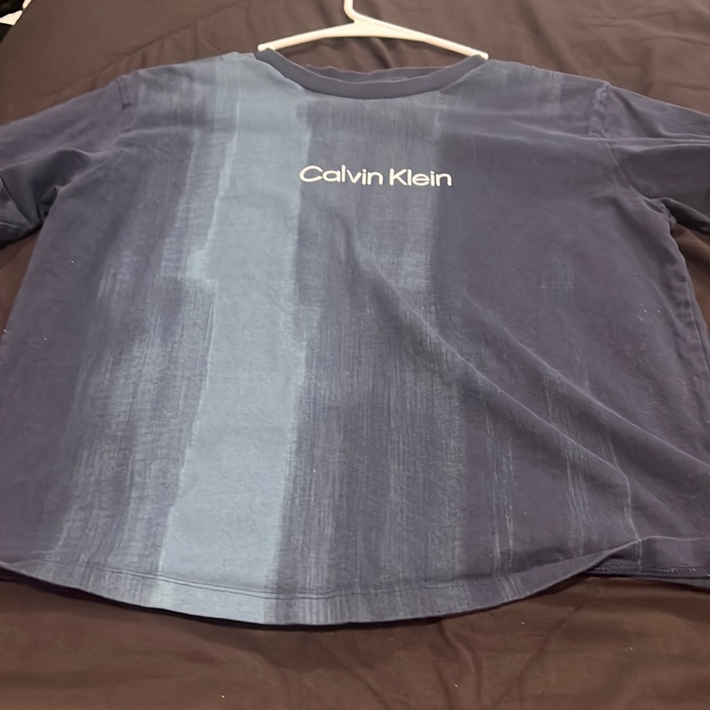 not worn a lot, t-shirt, navy blue, a little baggy